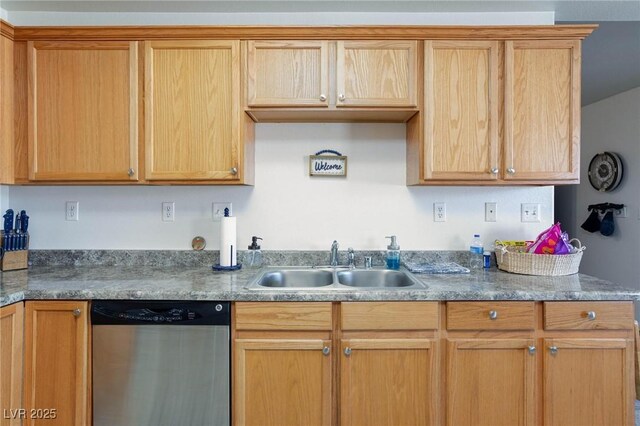 kitchen featuring dishwasher, light brown cabinets, and sink