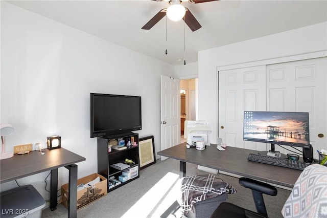 carpeted office with ceiling fan