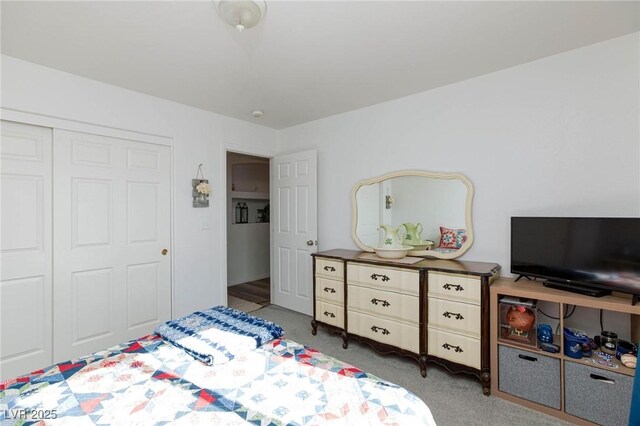 carpeted bedroom with a closet