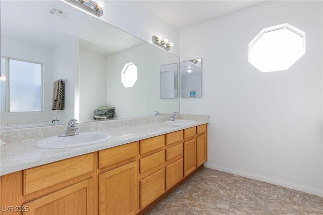 bathroom featuring vanity and plenty of natural light