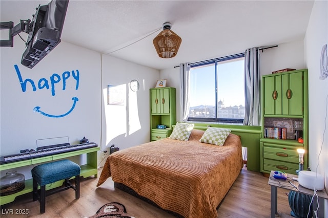 bedroom with light hardwood / wood-style floors