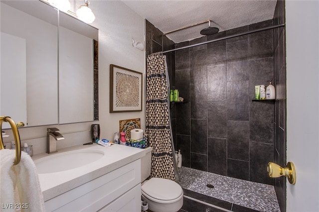 bathroom with toilet, a textured ceiling, walk in shower, and vanity