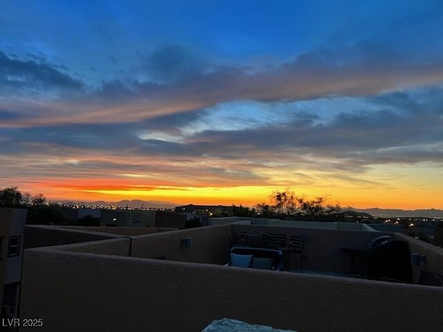 yard at dusk with a balcony