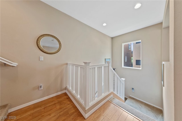 stairway featuring hardwood / wood-style flooring