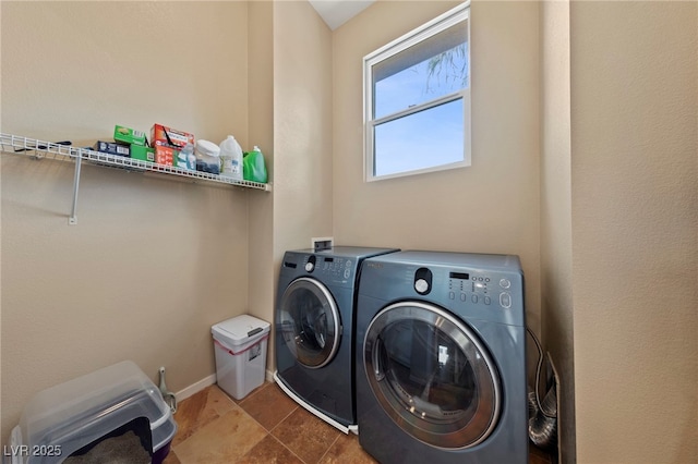 clothes washing area featuring washing machine and dryer