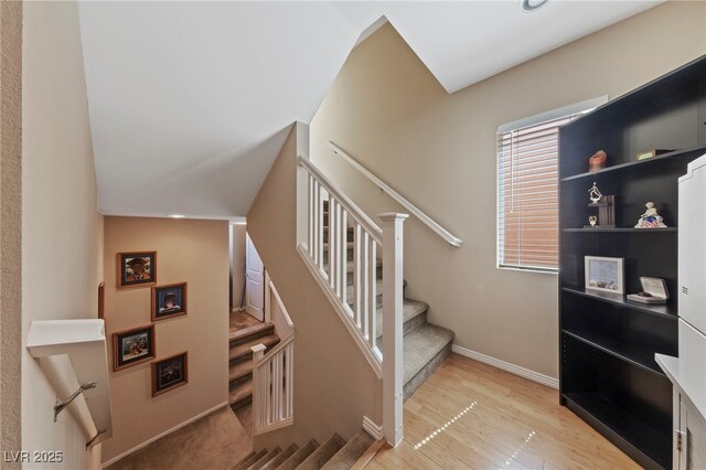 stairway with wood-type flooring