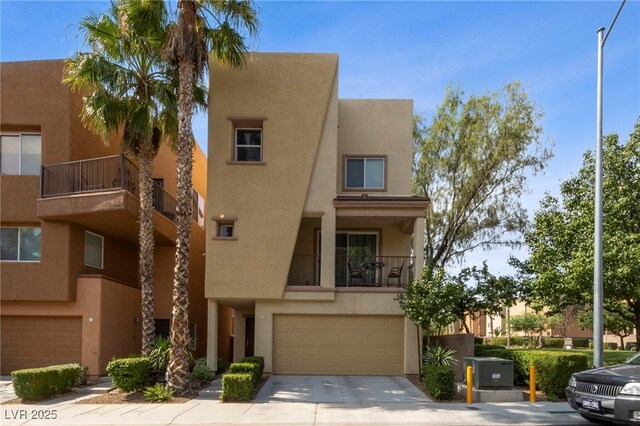 view of front of property with a balcony and a garage