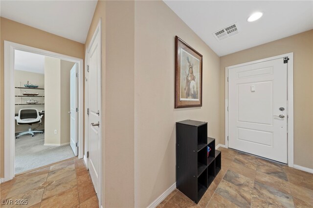 entryway featuring carpet floors