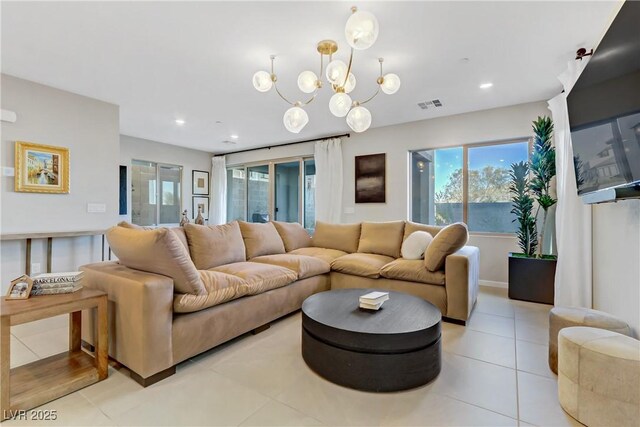 tiled living room with a chandelier