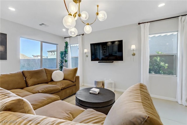 living room with a notable chandelier and a wealth of natural light