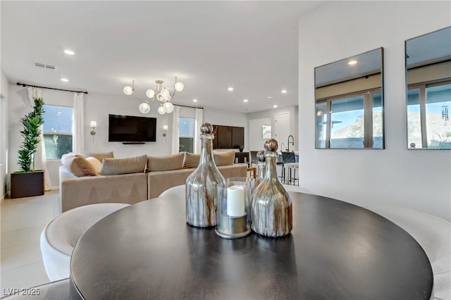 dining room with a chandelier and plenty of natural light