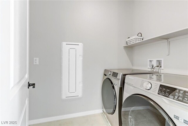 laundry room with washer and dryer