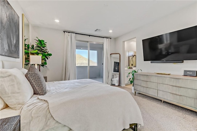 carpeted bedroom featuring access to outside