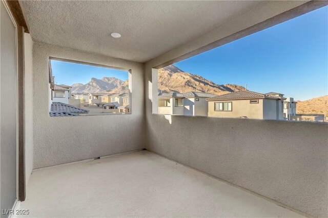 balcony featuring a mountain view