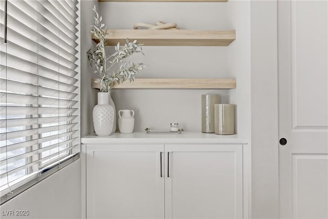 bar featuring white cabinets