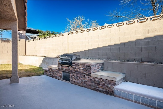 view of patio featuring a grill and area for grilling