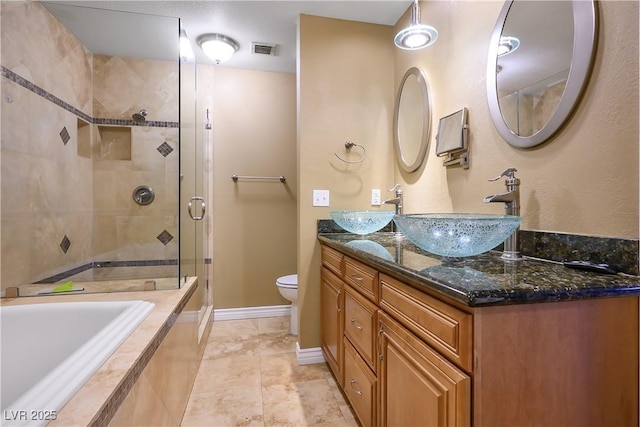 full bathroom featuring toilet, plus walk in shower, and vanity