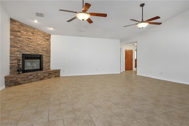 unfurnished living room featuring light tile patterned flooring, a fireplace, ceiling fan, and vaulted ceiling