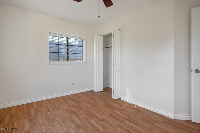 unfurnished bedroom featuring ceiling fan and light hardwood / wood-style flooring