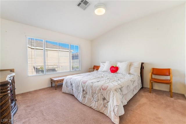 bedroom with lofted ceiling and light carpet