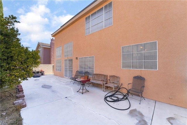 rear view of house with a patio