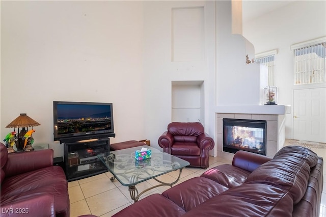 tiled living room with a tiled fireplace