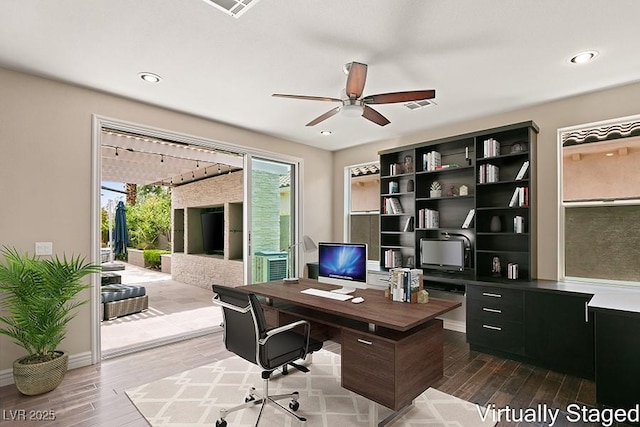 office space featuring wood-type flooring and ceiling fan