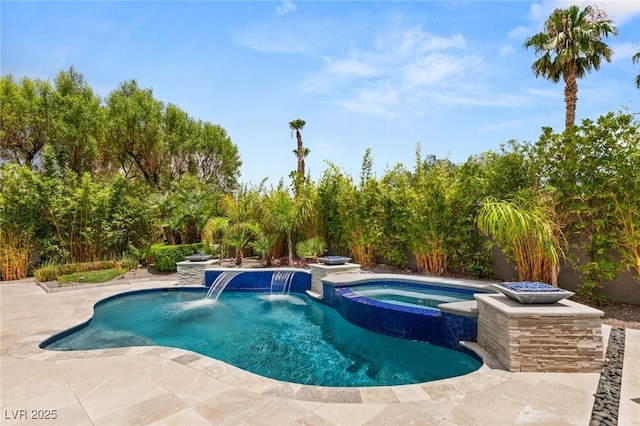 view of swimming pool featuring pool water feature, an in ground hot tub, and a patio