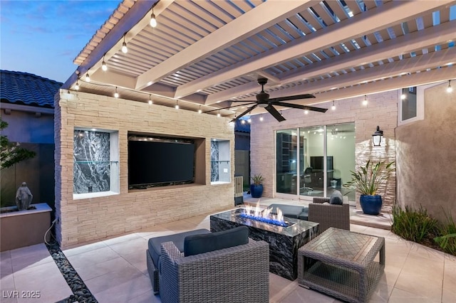 view of patio with ceiling fan and a fire pit