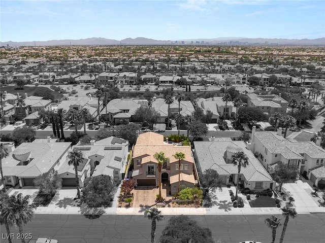 birds eye view of property with a mountain view