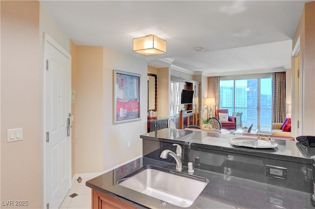 kitchen featuring sink and light tile patterned floors