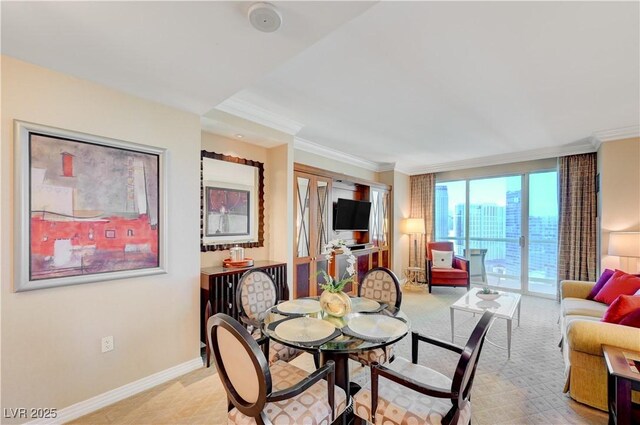 dining space featuring light colored carpet and crown molding