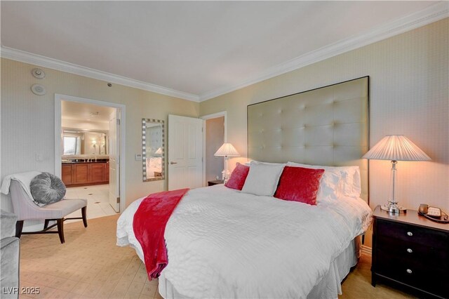 bedroom featuring connected bathroom and crown molding