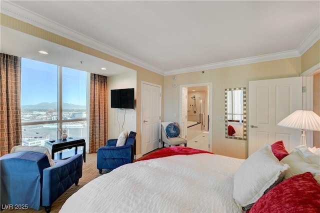 bedroom with ensuite bath, multiple windows, and crown molding