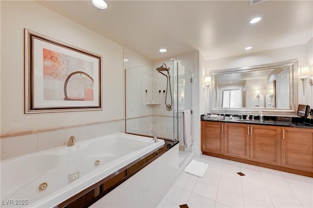 bathroom featuring vanity, tile patterned floors, and shower with separate bathtub