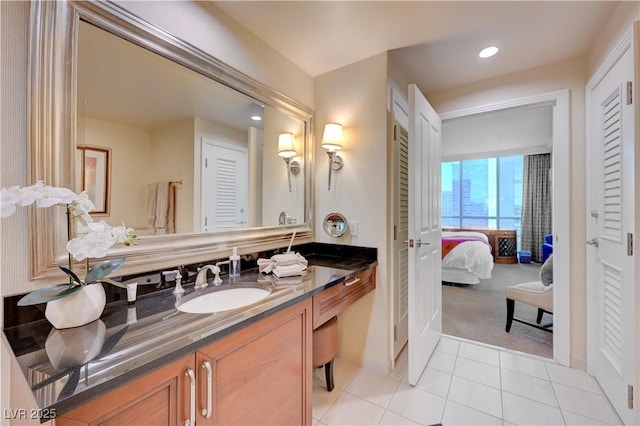 bathroom featuring tile patterned floors and vanity