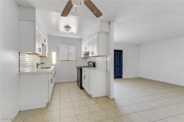 kitchen with sink, black electric range, white cabinetry, and tasteful backsplash