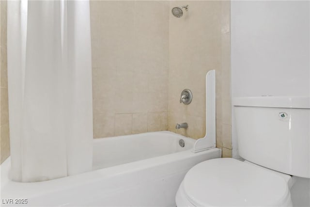 bathroom with toilet and shower / tub combo