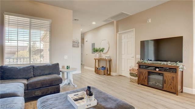 living room with light hardwood / wood-style floors