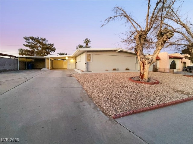 single story home with a carport