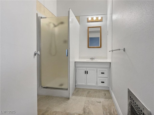 bathroom featuring vanity and walk in shower