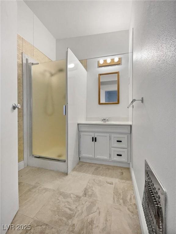 bathroom with an enclosed shower and vanity