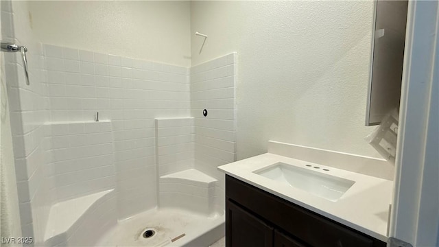 bathroom featuring vanity and walk in shower