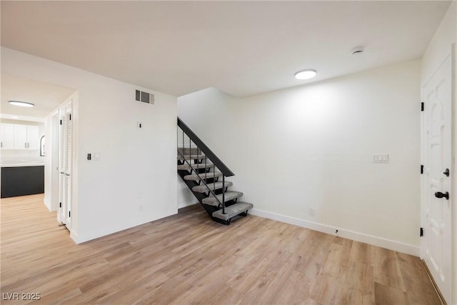 spare room with light wood-type flooring