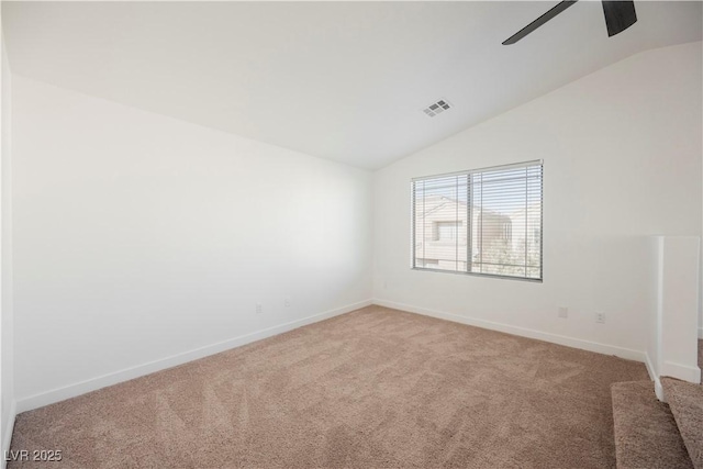 unfurnished room featuring lofted ceiling, carpet floors, and ceiling fan