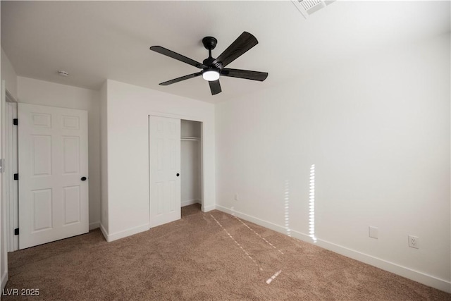 unfurnished bedroom with carpet flooring, a closet, and ceiling fan