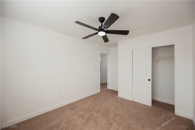 unfurnished bedroom with ceiling fan, a closet, and carpet flooring