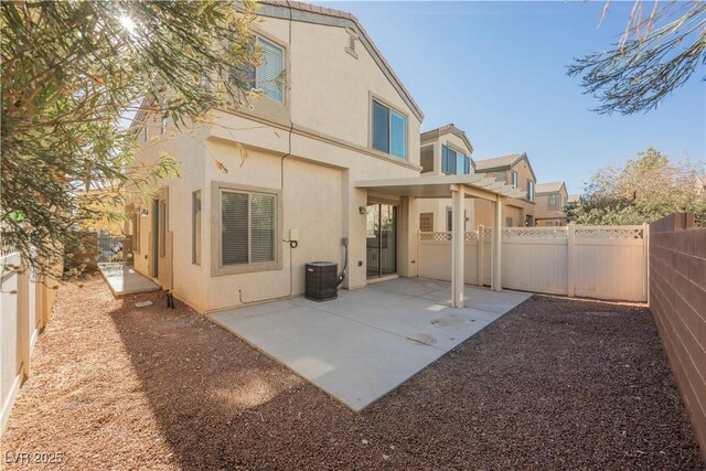 back of house with a patio area