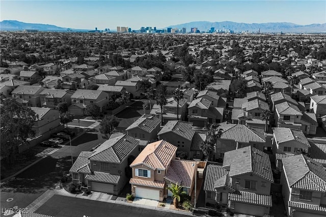 drone / aerial view featuring a mountain view