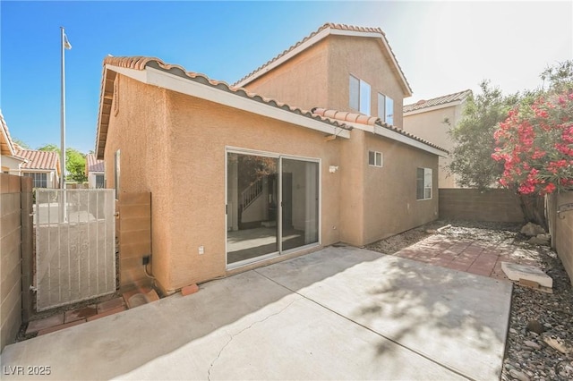 back of property featuring a patio area